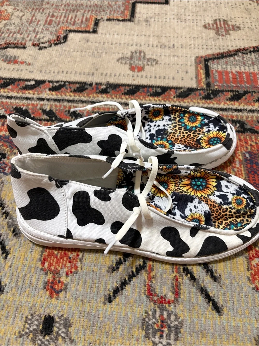 Women’s White & Black Cow Print Slip-On Sneakers with Sunflower Lining